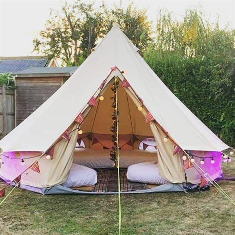 4m bell tent in a garden