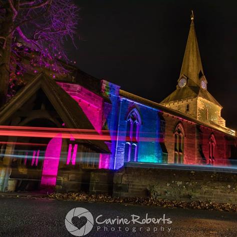 Church lit in yellow and red